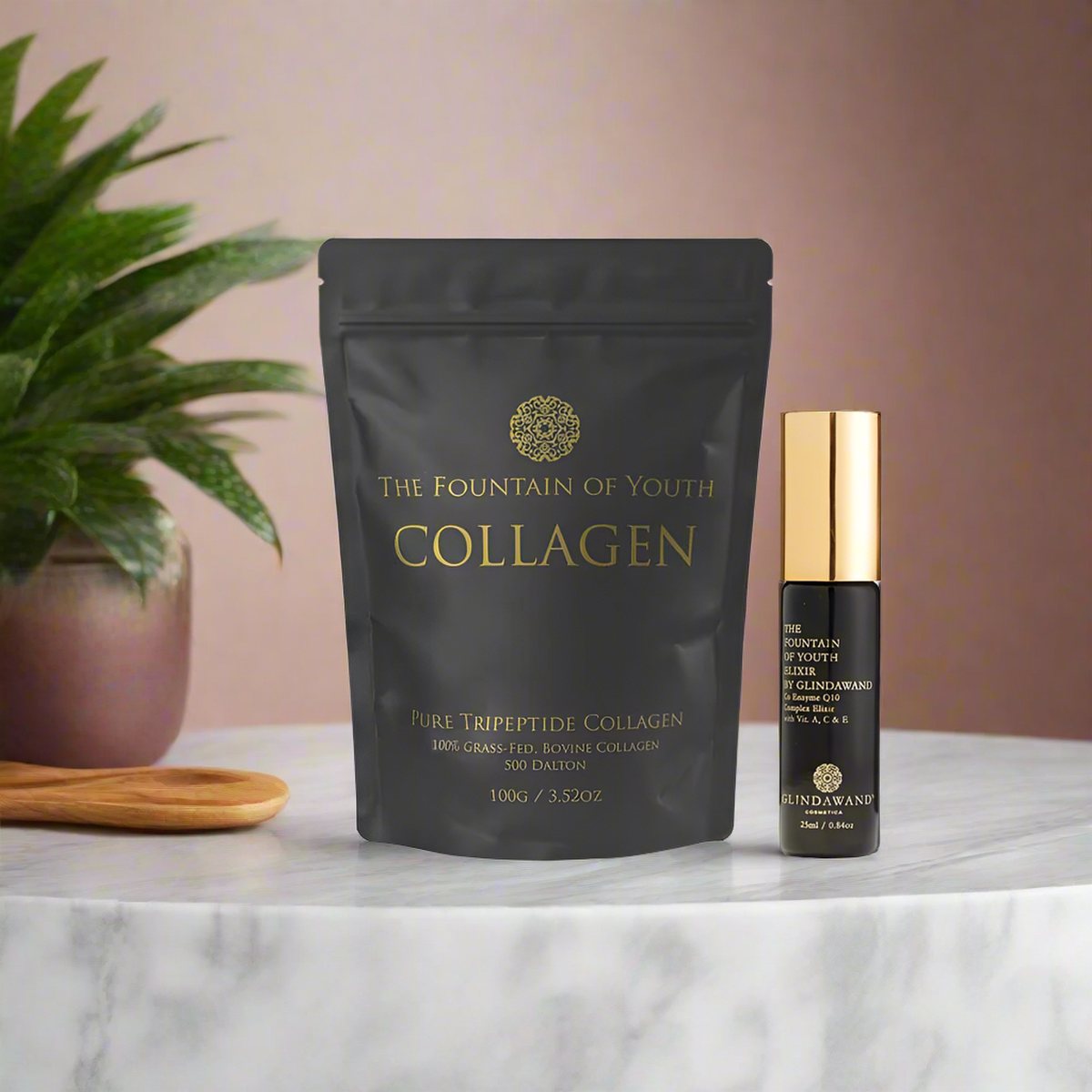 The Pure Tripeptide Collagen 100g bag beside The Fountain of Youth Elixir on a marble plinth