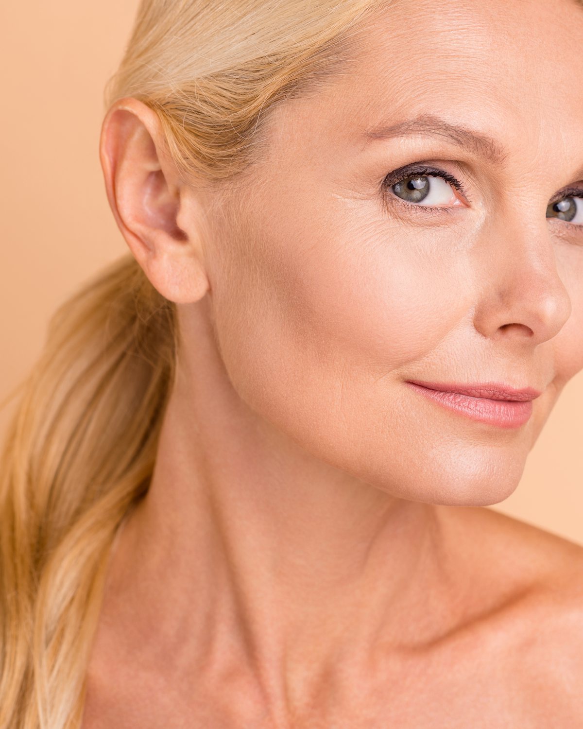 A woman in her fifties with radiant, even skin