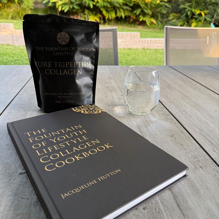 Customer photo of the collagen bag and the Fountain of Youth Lifestyle Collagen Cookbook on an outdoor table
