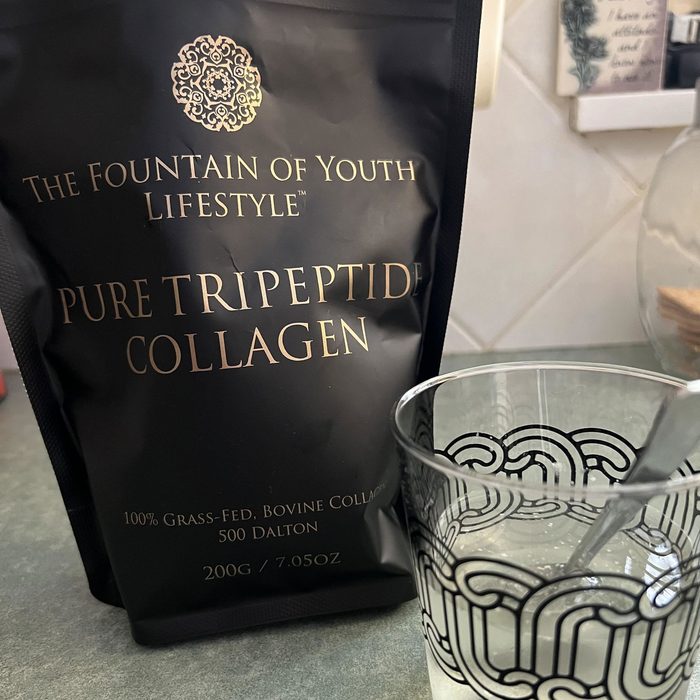 Customer photo of the Pure Tripeptide Collagen bag beside a glass
